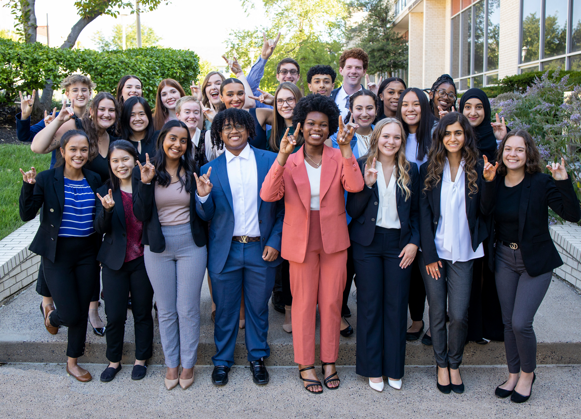 UMKC trustee scholars taking a photo together and rooing up