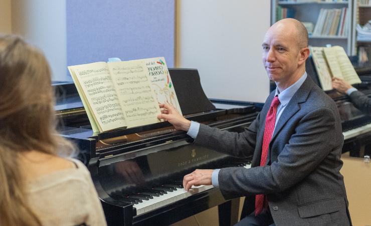 Dean Courtney Crappell seated at the piano