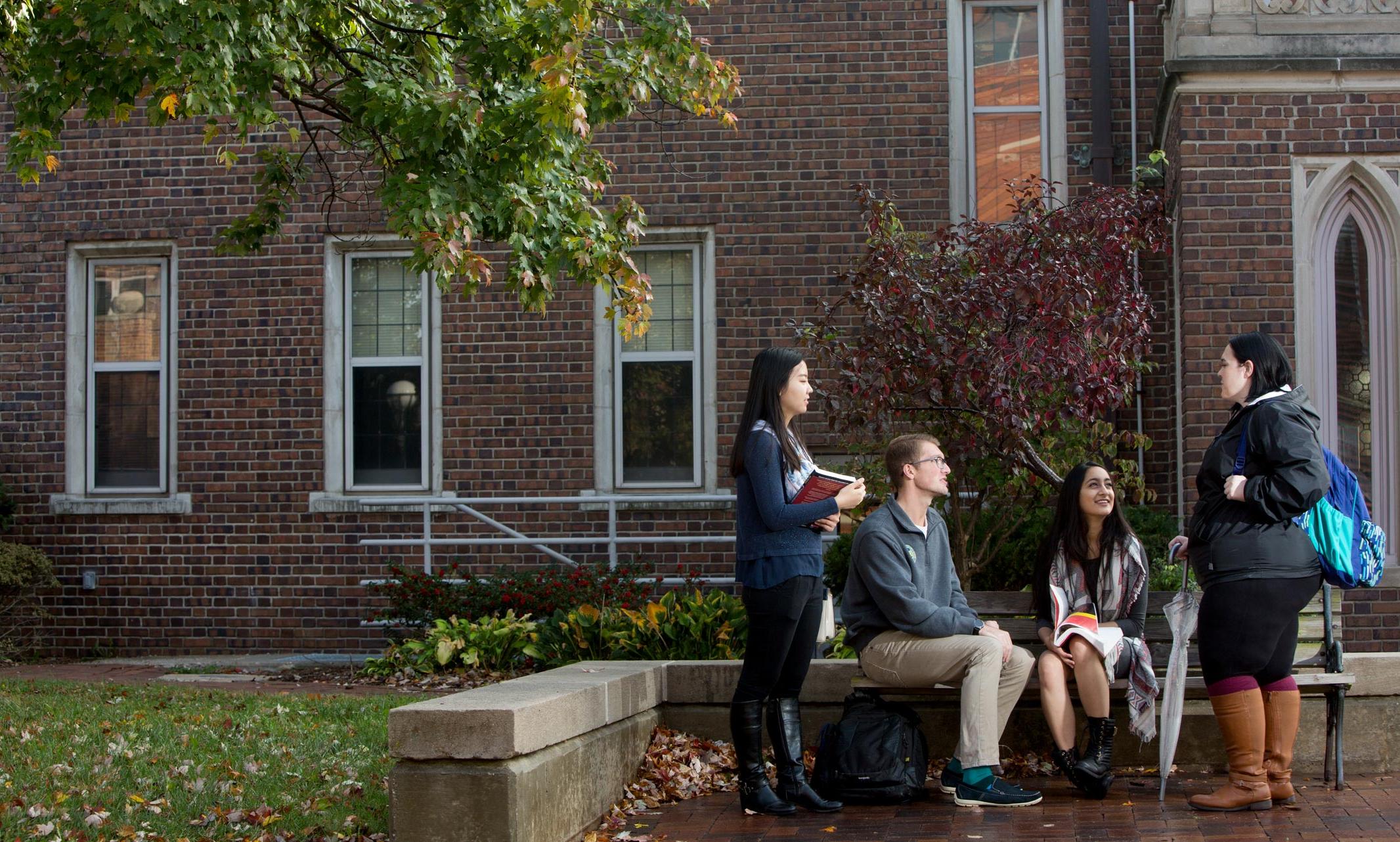 students talking outside Bloch Heritage Hall