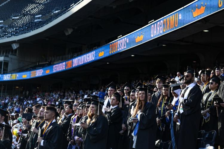 Graduates in the stands of Kauffman Stadium