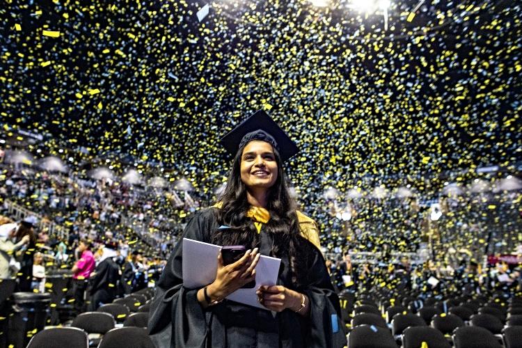 Confetti at commencement with a female grad