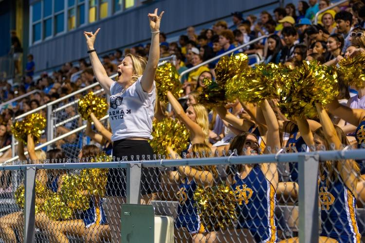 Female standing in crowd doing Roo Up